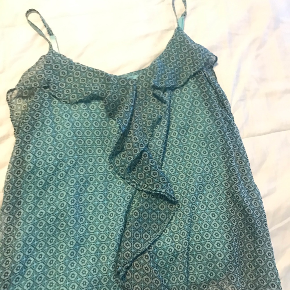 Blue geometric tank with ruffle and overlay